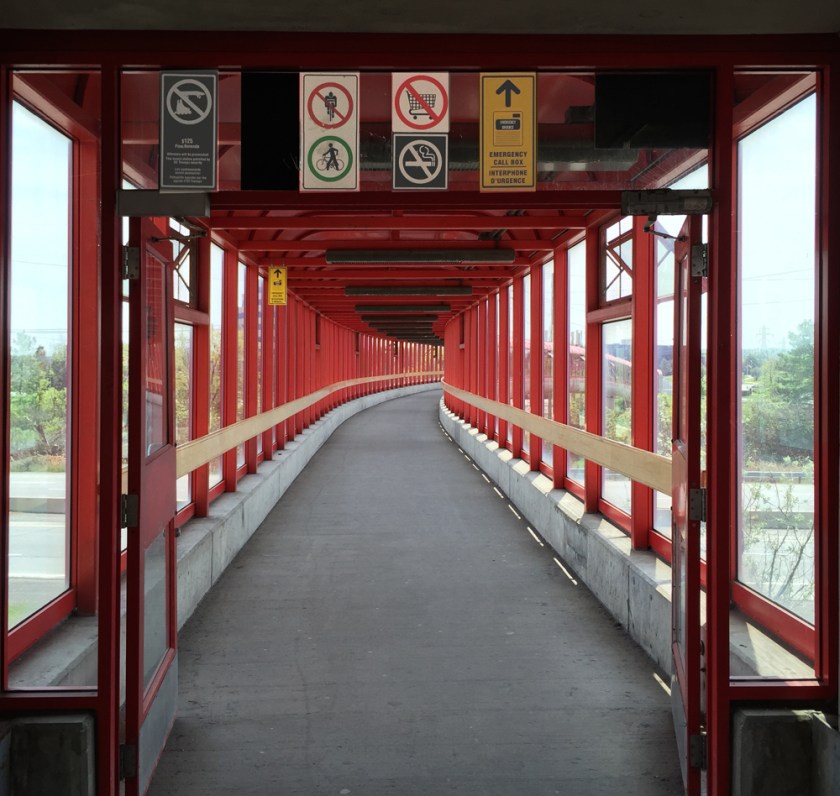 Crossing the pedestrian bridge over the Queensway