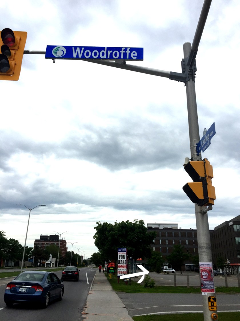 And away we go! Arrow points across parking lot towards Woodland Ave